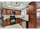 Well-lit kitchen featuring stainless steel appliances, granite counters, and wood cabinetry at 9451 E Becker Ln # 1051, Scottsdale, AZ 85260