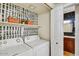 The laundry room features a washer, dryer, storage shelves, and an accent wall at 9451 E Becker Ln # 1051, Scottsdale, AZ 85260