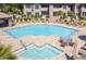 Resort style community pool and spa with lots of lounge chairs at 9451 E Becker Ln # 1051, Scottsdale, AZ 85260