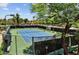 Community tennis court surrounded by mature trees and well-kept landscaping, offering a great amenity at 9451 E Becker Ln # 1051, Scottsdale, AZ 85260
