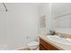Bathroom featuring a shower, framed mirror, vanity with updated fixtures and decor at 973 E Kelsi Ave, San Tan Valley, AZ 85140