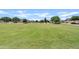 Expansive community park with open green spaces and walking paths, ideal for recreation and relaxation at 973 E Kelsi Ave, San Tan Valley, AZ 85140