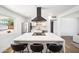 Bright, modern kitchen with stainless steel appliances, white cabinets, and a large center island with seating at 1017 E Diana Ave, Phoenix, AZ 85020