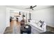 Open concept living room featuring modern furniture, a ceiling fan, and seamless access to the adjacent kitchen at 1017 E Diana Ave, Phoenix, AZ 85020