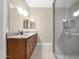 Well-lit bathroom with a double sink vanity with granite countertops and a glass-enclosed shower at 10536 W Villa Hermosa --, Peoria, AZ 85383