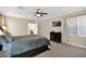 Cozy bedroom featuring neutral tones, ceiling fan and plush carpeting at 10536 W Villa Hermosa --, Peoria, AZ 85383