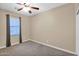 This bedroom includes neutral walls, carpet, window with blinds, and a ceiling fan at 10536 W Villa Hermosa --, Peoria, AZ 85383
