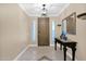 Inviting entryway with tile flooring, decorative mirror and elegant table at 10536 W Villa Hermosa --, Peoria, AZ 85383