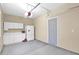 Spacious garage with white cabinets, a utility sink, and a well-lit interior at 10536 W Villa Hermosa --, Peoria, AZ 85383
