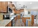 Bright kitchen with granite countertops, stainless steel appliances, and custom cabinets at 10536 W Villa Hermosa --, Peoria, AZ 85383