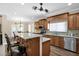 Kitchen featuring granite counters, a center island with seating, and stainless steel appliances at 10536 W Villa Hermosa --, Peoria, AZ 85383
