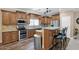 Kitchen boasting granite countertops, stainless steel appliances, and a functional center island with barstool seating at 10536 W Villa Hermosa --, Peoria, AZ 85383