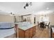 View of the open-concept kitchen featuring granite countertops, custom wood cabinets, and stainless appliances at 10536 W Villa Hermosa --, Peoria, AZ 85383