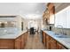 Modern kitchen with granite countertops, stainless steel appliances, and open view to the dining area at 10536 W Villa Hermosa --, Peoria, AZ 85383