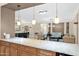 Open-concept living room with a bar area, elegant seating, and stylish decor at 10536 W Villa Hermosa --, Peoria, AZ 85383