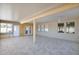 Spacious covered patio with tiled floors, multiple windows, and access to the backyard at 10536 W Villa Hermosa --, Peoria, AZ 85383