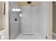 Elegant glass shower featuring marble tiling, a rain shower head, and modern fixtures at 10536 W Villa Hermosa --, Peoria, AZ 85383