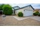 Charming single-story home featuring a well-maintained front yard and a two-car garage at 11022 N 60Th Dr, Glendale, AZ 85304