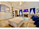 Inviting living room with tile floors, a fireplace, a TV, and comfortable seating at 11022 N 60Th Dr, Glendale, AZ 85304