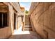 Backyard area with stairs leading to an upper level, showcasing the exterior and potential for outdoor living at 1134 W 2Nd St, Mesa, AZ 85201