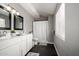 Modern bathroom featuring a dual sink vanity with marble countertop and framed mirrors and shower/tub combination at 1134 W 2Nd St, Mesa, AZ 85201