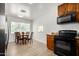 Bright dining room with a pass-through from the kitchen, wood-style flooring, and natural light at 1134 W 2Nd St, Mesa, AZ 85201