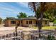 A front three-quarters view of a single-story brick home with large drive and desert landscaping at 1134 W 2Nd St, Mesa, AZ 85201