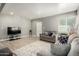 Inviting living room with neutral walls, light wood floors, and comfortable gray sofas at 1134 W 2Nd St, Mesa, AZ 85201