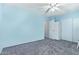 Bright bedroom offers soft carpeting and a large closet for ample storage space at 12422 W Rosewood Dr, El Mirage, AZ 85335