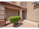 Inviting tan-colored two-story home with a covered front porch at 12422 W Rosewood Dr, El Mirage, AZ 85335