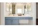 Bathroom vanity features double mirrors, bright vanity lighting, and a spacious counter at 13241 W Desert Ln, Surprise, AZ 85374