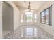 Bright and spacious dining area featuring a large window and tile flooring, perfect for entertaining at 13241 W Desert Ln, Surprise, AZ 85374
