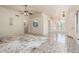 Open-concept living room boasts a view of the kitchen and dining area, enhancing the home's flow and modern appeal at 13241 W Desert Ln, Surprise, AZ 85374