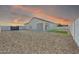 Spacious backyard showcasing low-maintenance gravel landscaping and a covered patio at 14178 S Diablo Rd, Arizona City, AZ 85123