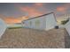 Extensive backyard with gravel landscaping, offering ample space and privacy at 14178 S Diablo Rd, Arizona City, AZ 85123