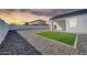 Spacious backyard features gravel landscaping and a small patch of grass at 14178 S Diablo Rd, Arizona City, AZ 85123