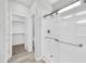 Modern bathroom featuring a glass enclosed shower and a view to the walk-in closet at 14178 S Diablo Rd, Arizona City, AZ 85123
