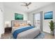 Stylish bedroom featuring a cozy bed, modern decor, and ample natural light at 14178 S Diablo Rd, Arizona City, AZ 85123