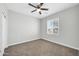 Bedroom featuring carpet, ceiling fan, window with blinds, and natural lighting at 14178 S Diablo Rd, Arizona City, AZ 85123