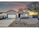 Charming single-story home featuring desert landscaping and a spacious two-car garage at 14178 S Diablo Rd, Arizona City, AZ 85123
