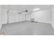 Spacious two-car garage with epoxy flooring and white walls at 14178 S Diablo Rd, Arizona City, AZ 85123