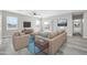 Cozy living room features a neutral sitting area and a door leading to the backyard at 14178 S Diablo Rd, Arizona City, AZ 85123