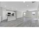Spacious living area boasts neutral color palette, wood flooring and natural light at 14178 S Diablo Rd, Arizona City, AZ 85123