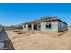 View of the backyard, featuring a newly installed pool and a stucco finished exterior with covered patio at 14687 N 73Rd Dr, Peoria, AZ 85381
