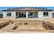 View of the backyard, featuring a newly installed pool and a stucco finished exterior with covered patio at 14687 N 73Rd Dr, Peoria, AZ 85381