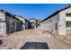 New construction homes boast a shared driveway, showing modern gray stucco and tile roofing details at 14687 N 73Rd Dr, Peoria, AZ 85381