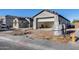 New construction home featuring modern architecture and a two-car garage, awaiting landscaping at 14687 N 73Rd Dr, Peoria, AZ 85381