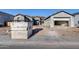 Modern new construction homes featuring a distinctive rounded tower entrance, gray stucco and tile roofing at 14687 N 73Rd Dr, Peoria, AZ 85381