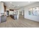 Bright kitchen with an open layout, an island, and contemporary gray and white cabinetry at 14687 N 73Rd Dr, Peoria, AZ 85381
