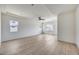 Expansive living room with ample natural light, sleek ceiling fan and continuous flooring at 14687 N 73Rd Dr, Peoria, AZ 85381